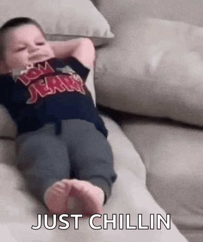 Lil Kid Chilling Chilling On Couch GIF