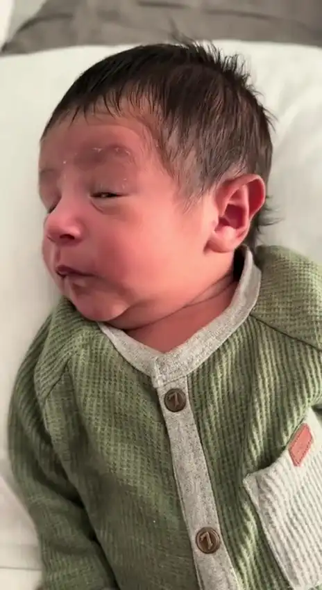 Baby giving side eye meme