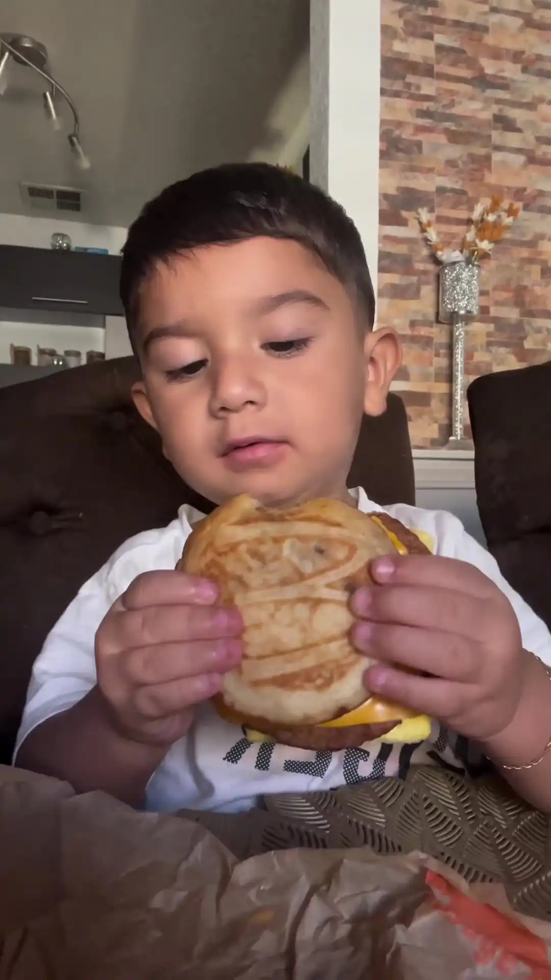 Kid eating McDonald sandwich meme