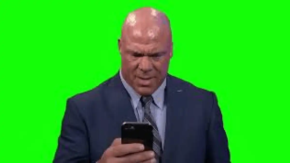 Kurt Angle looking at phone meme green screen