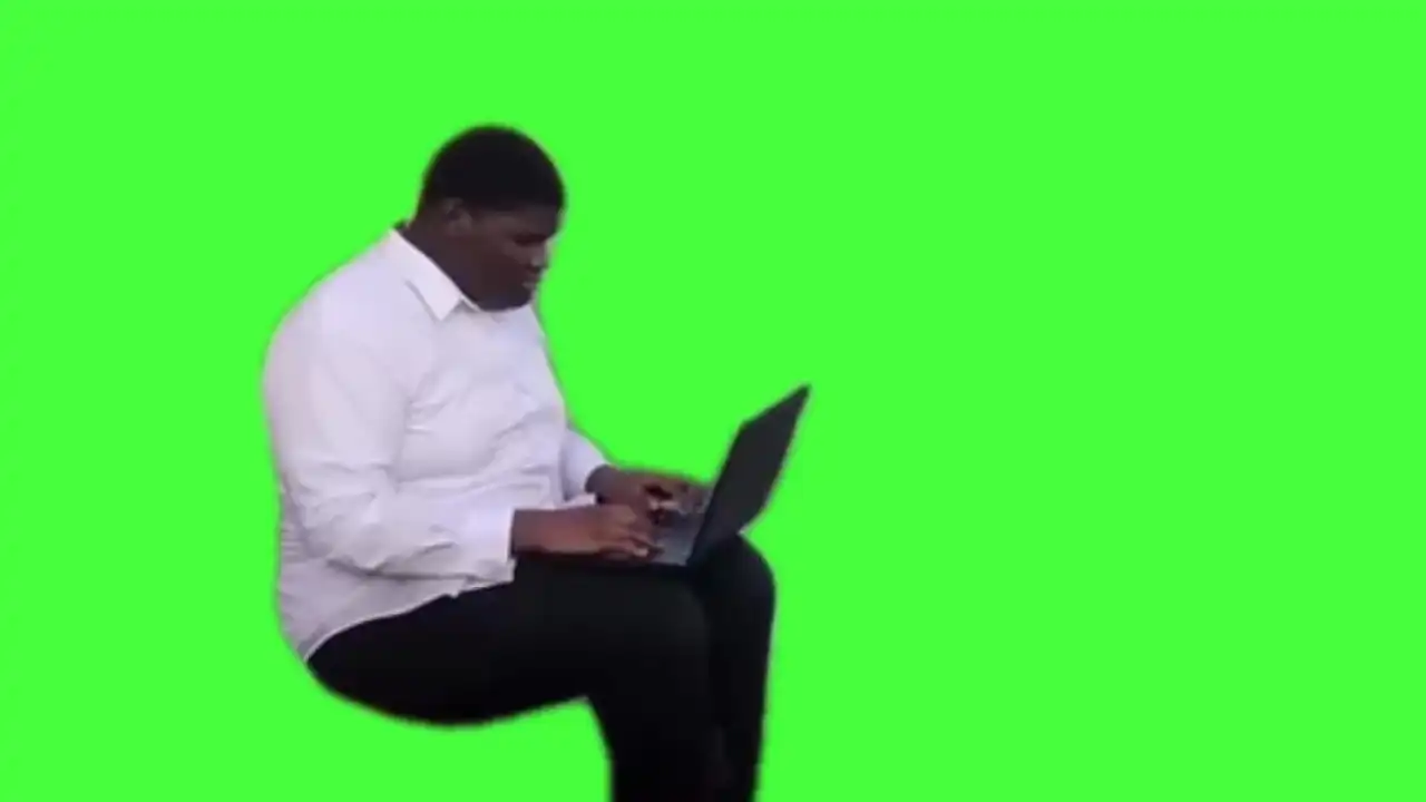 Man working on laptop meme green screen