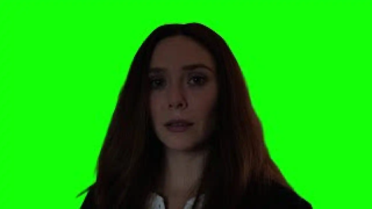 Scarlet Witch Wanda stares into the camera green screen